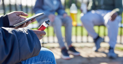 holding a vape electronic device